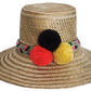 Boho Wayuu straw hat with natural weave, colorful braided band, and vibrant pom-poms in black, red, and yellow — a handcrafted, bohemian summer accessory full of artisan charm.