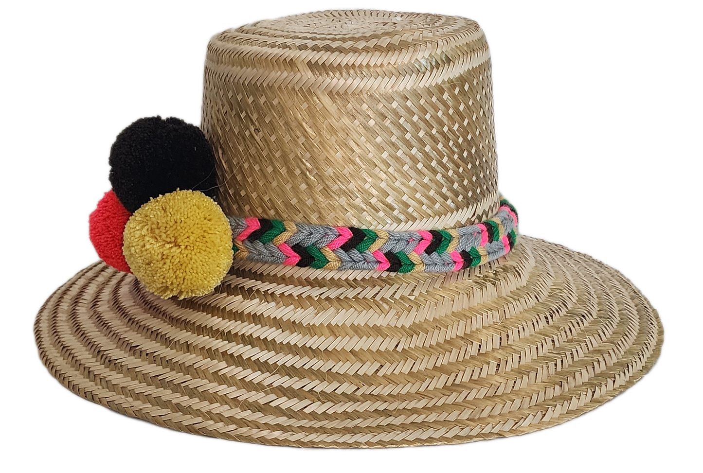 Boho Wayuu straw hat with natural weave, colorful braided band, and vibrant pom-poms in black, red, and yellow — a handcrafted, bohemian summer accessory full of artisan charm.