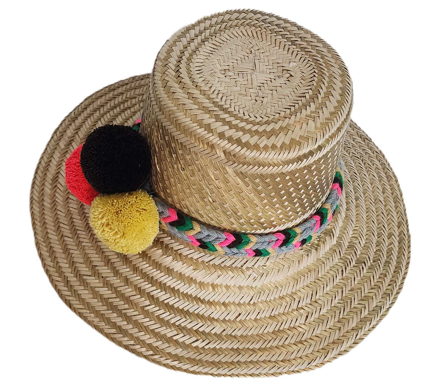 Boho Wayuu straw hat with natural weave, colorful braided band, and vibrant pom-poms in black, red, and yellow — a handcrafted, bohemian summer accessory full of artisan charm.