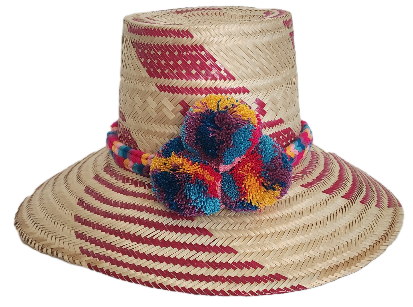Handmade straw hat with red woven designs and a cheerful, fluffy pompom band in shades of blue, red, yellow, and purple, adding a colorful touch.