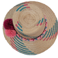 Handmade straw hat with bold pink, purple, and burgundy pompoms