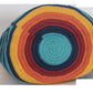 A vibrant, colorful crochet bag featuring a boho-Wayuu design. The item showcases intricate patterns typical of Bohemian and Wayuu style, with a rich mix of bright, eye-catching colors. Handmade, the bag exemplifies skilled crochet craftsmanship, ideal for adding a bohemian flair to any outfit.