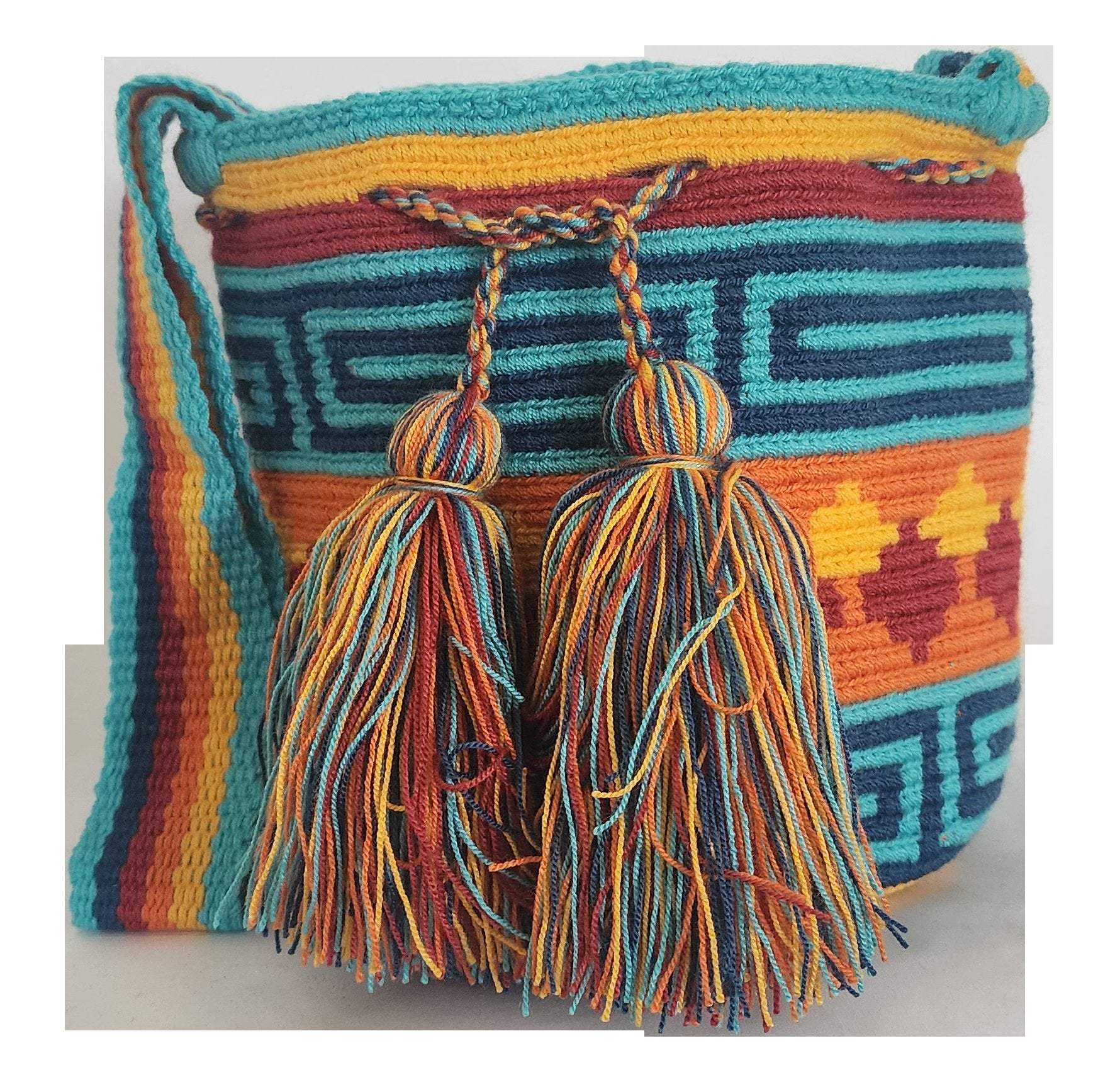 A vibrant, colorful crochet bag featuring a boho-Wayuu design. The item showcases intricate patterns typical of Bohemian and Wayuu style, with a rich mix of bright, eye-catching colors. Handmade, the bag exemplifies skilled crochet craftsmanship, ideal for adding a bohemian flair to any outfit.