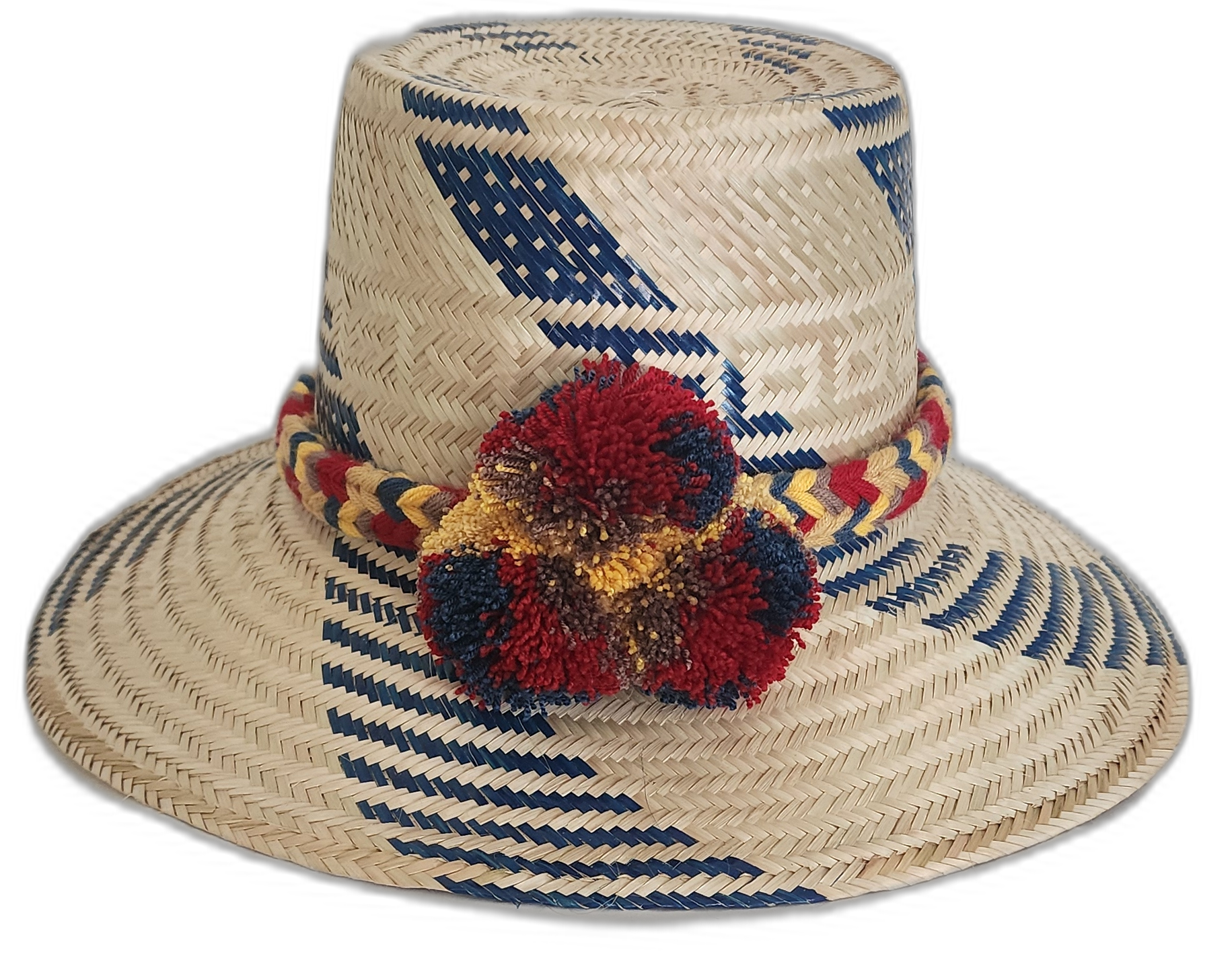 Handmade Wayuu straw hat with blue diagonal designs and vibrant pompoms