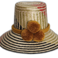 Handmade Wayuu hat with mustard yellow pompoms and black, olive, and red weave.Natural straw boho hat with mustard braided band and subtle artisan weave

