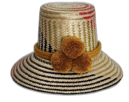 Handmade Wayuu hat with mustard yellow pompoms and black, olive, and red weave.Natural straw boho hat with mustard braided band and subtle artisan weave