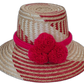 Adelyn handmade Wayuu straw hat with red and natural palm weave and large red pompoms

