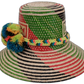 Artisan Wayuu hat Alani with natural straw base and vibrant multicolor pompoms


