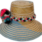 Boho Wayuu hat Alexa with multicolor pompoms and artisan weave in blue, pink, and natural tones

