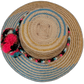 Alexa straw hat with blue geometric pattern and pompoms in pink, black, white, and brown

