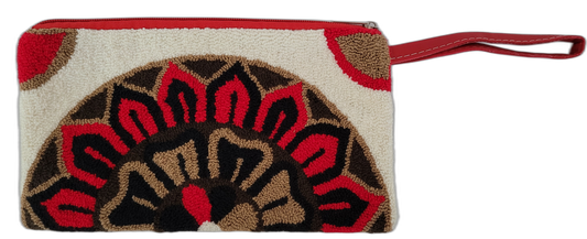 Boho wristlet clutch with bold artisan design and red leather strap

