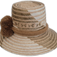 Artisan-crafted Wayuu hat featuring beige straw and brown pompoms.

