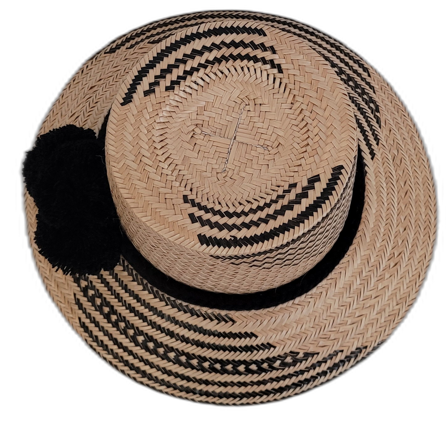 Artisan-crafted Wayuu straw hat featuring chic black pompoms.

