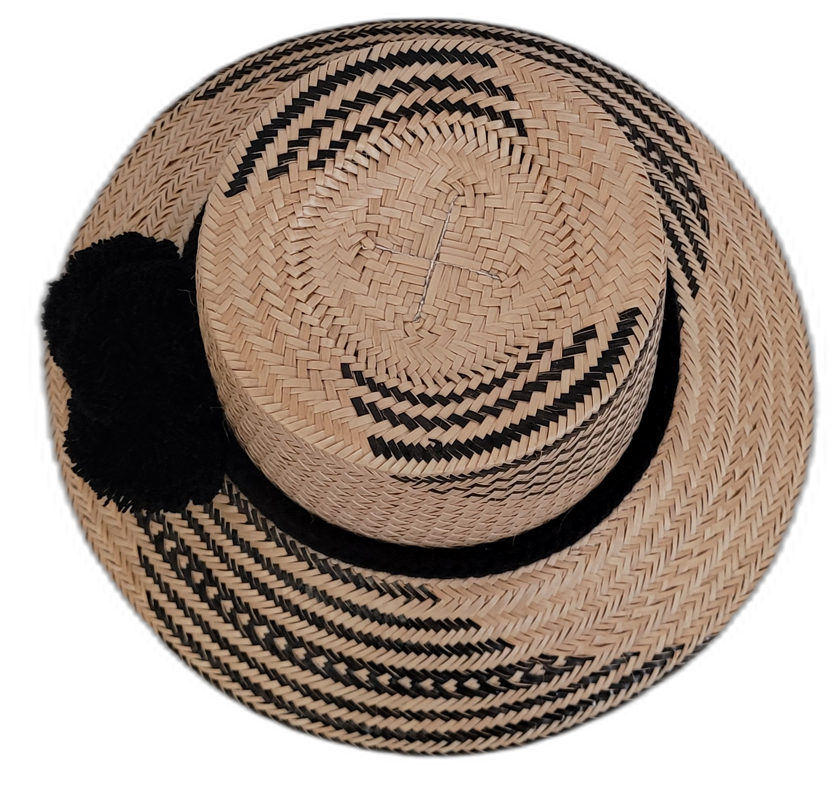 Artisan-crafted Wayuu straw hat featuring chic black pompoms.

