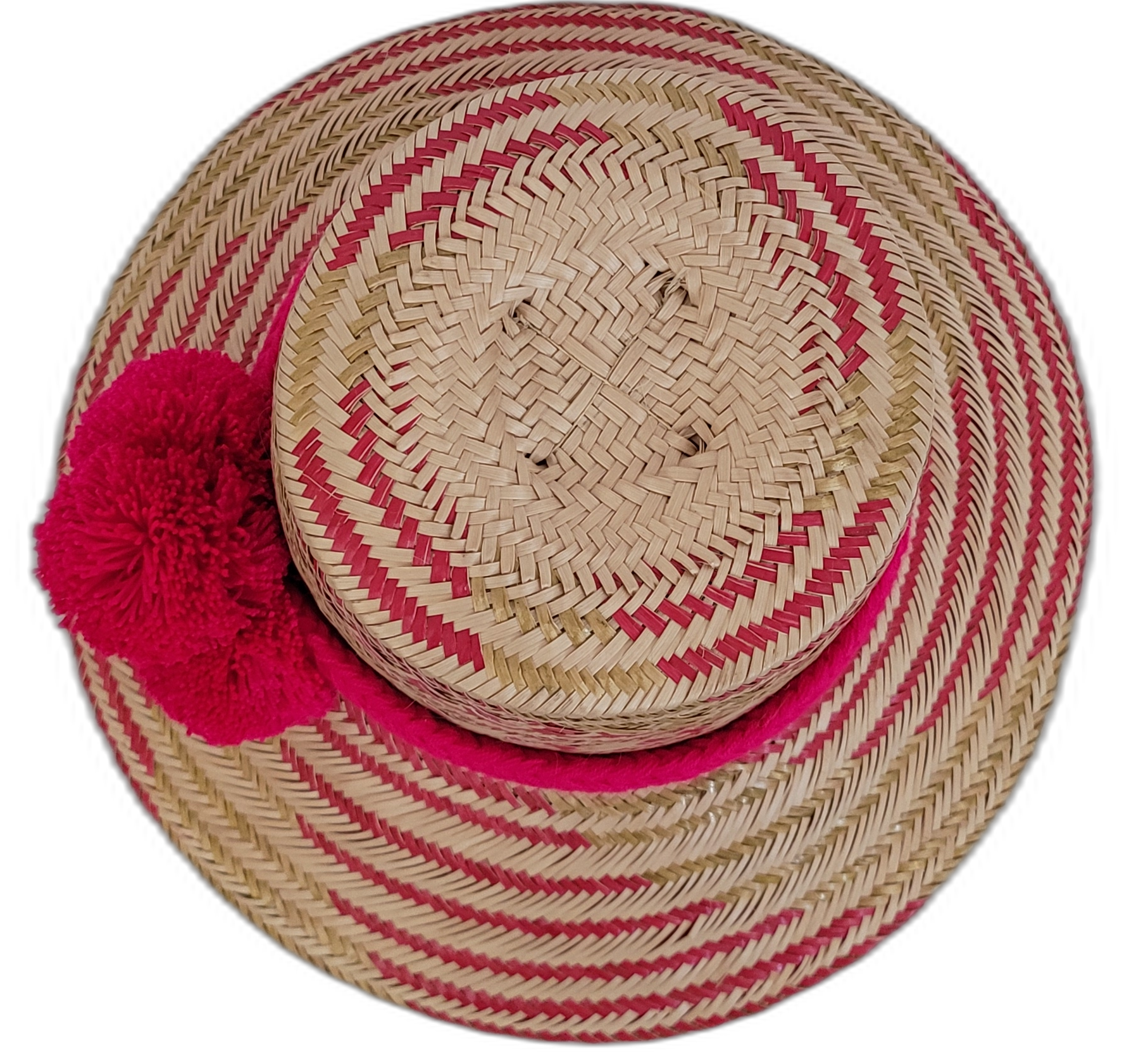 Artisan Wayuu straw hat with bright red pompoms, perfect for summer.

