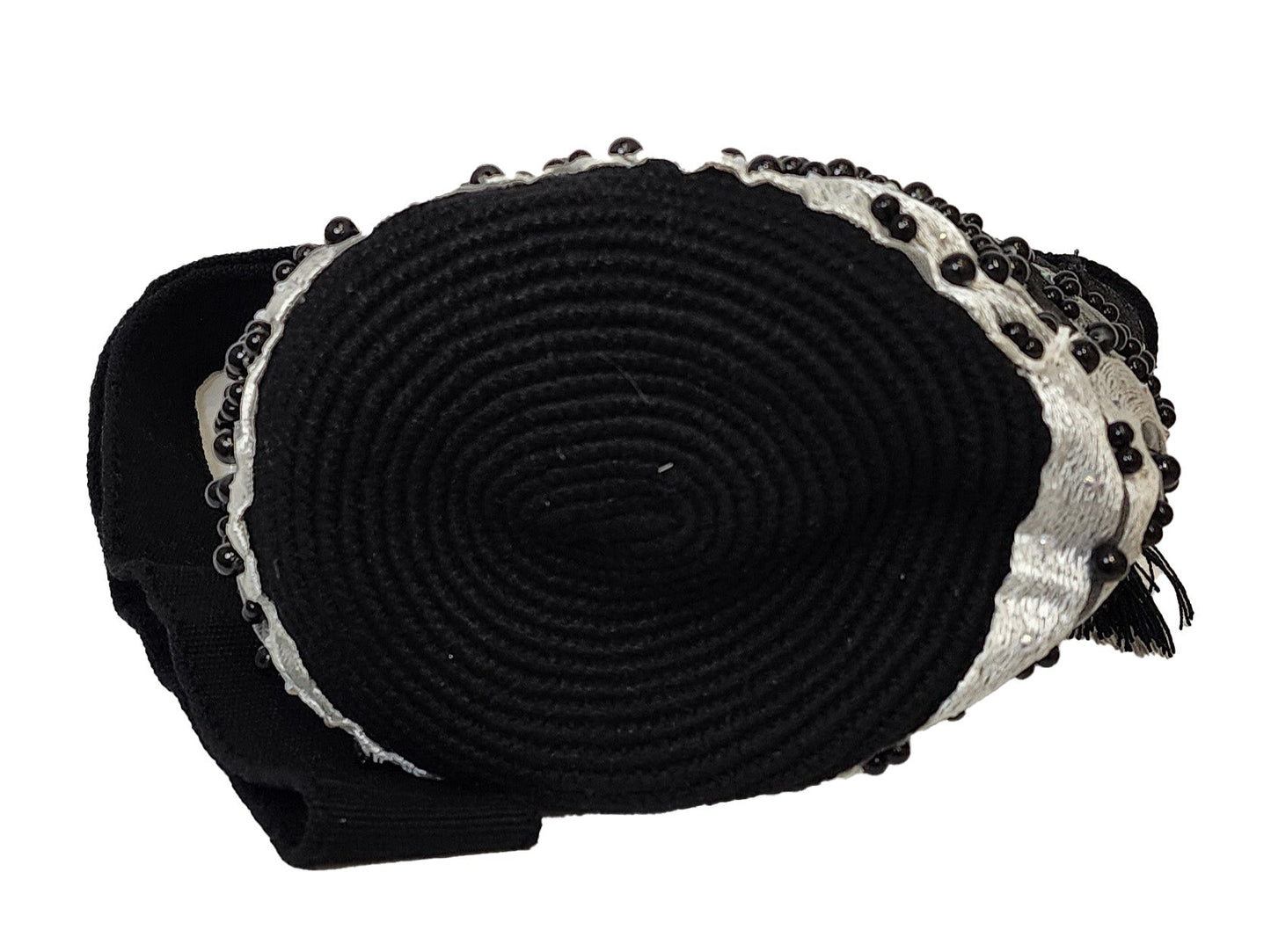 Artisan Wayuu bag in black and white, featuring bold beading and texture.