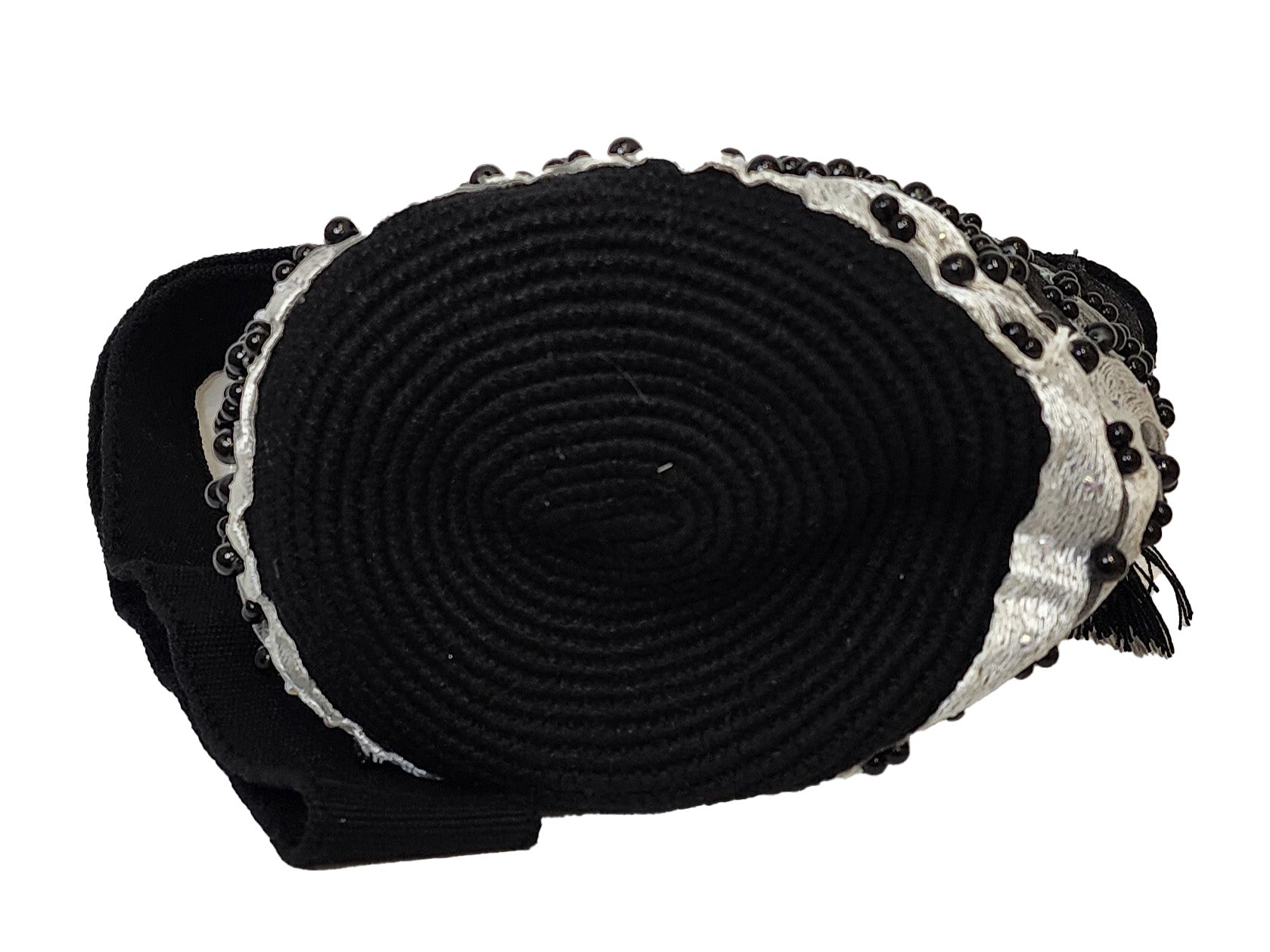 Artisan Wayuu bag in black and white, featuring bold beading and texture.