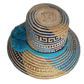 Artisan Wayuu hat with blue tribal-inspired design and bright pompoms