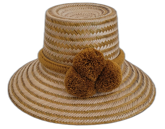 Handcrafted Wayuu natural straw hat with olive-ochre pompoms.

