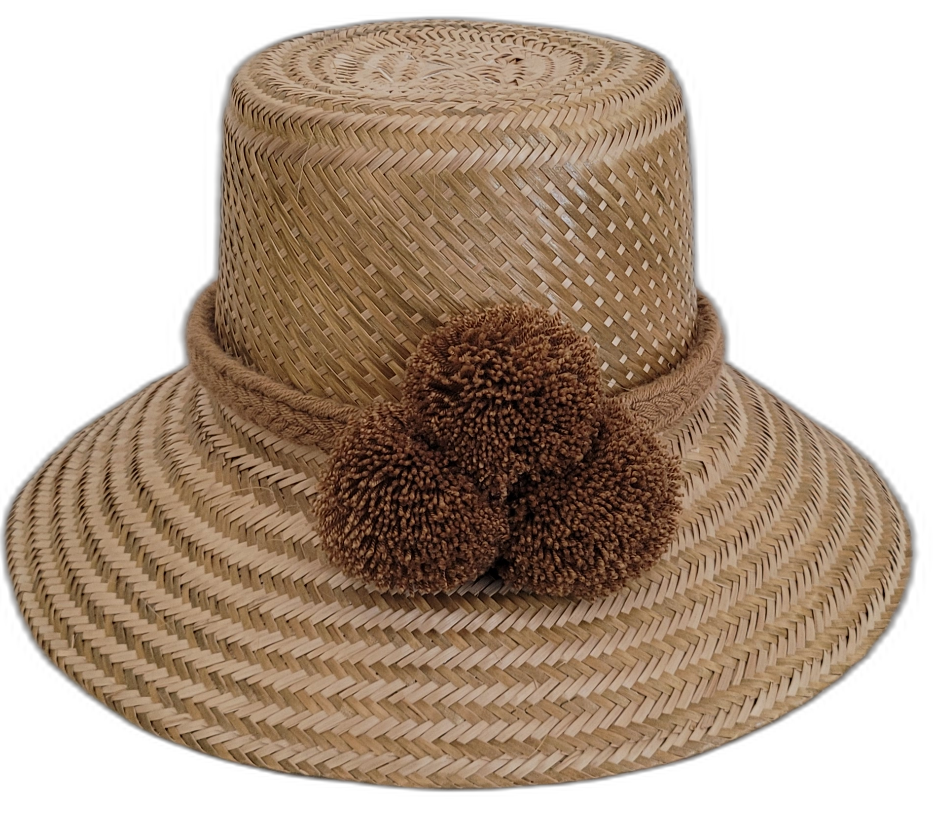 Solid natural Wayuu straw hat handmade with brown pompoms.

