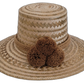 Natural Wayuu hat with fine zigzag weave and brown pompoms.

