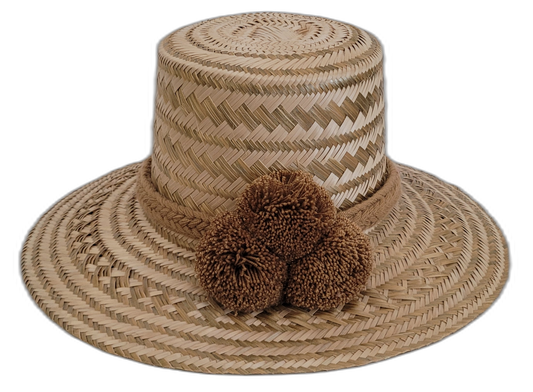 Natural Wayuu hat with fine zigzag weave and brown pompoms.

