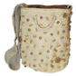 Bohemian handmade Wayuu bag with tassels, soft tones, and refined details.