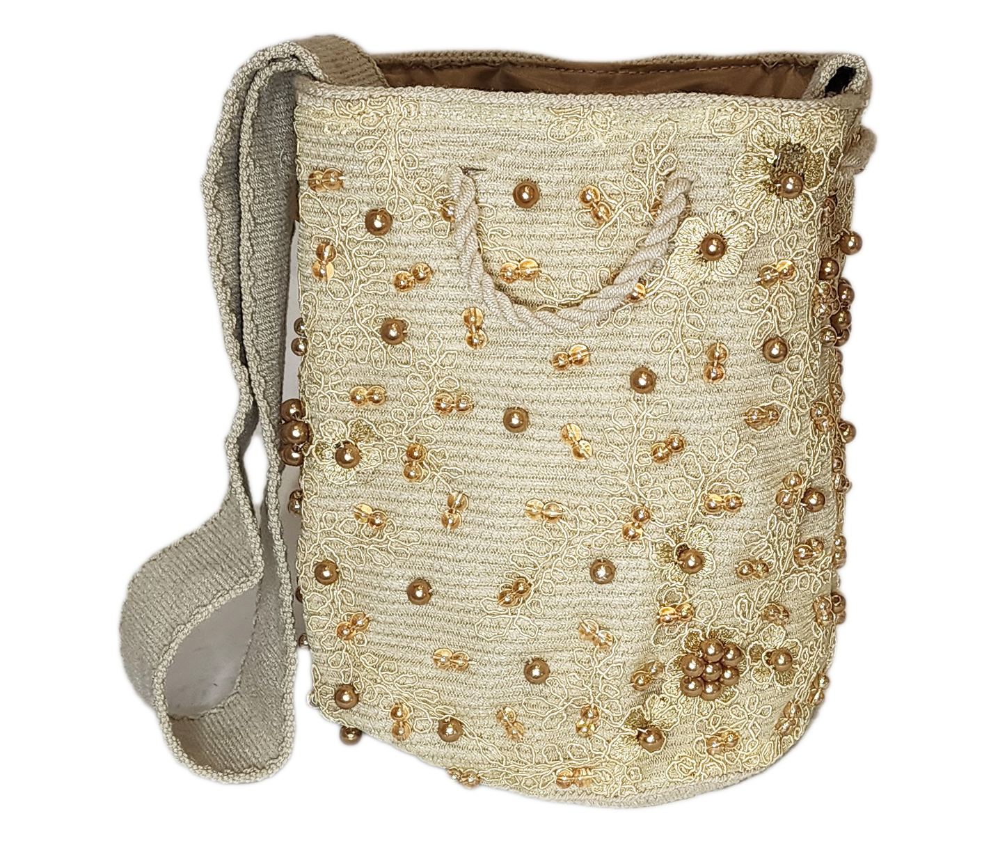 Bohemian handmade Wayuu bag with tassels, soft tones, and refined details.
