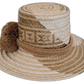 Boho Wayuu hat crafted with earth-tone weave and adorned with brown pompoms.

