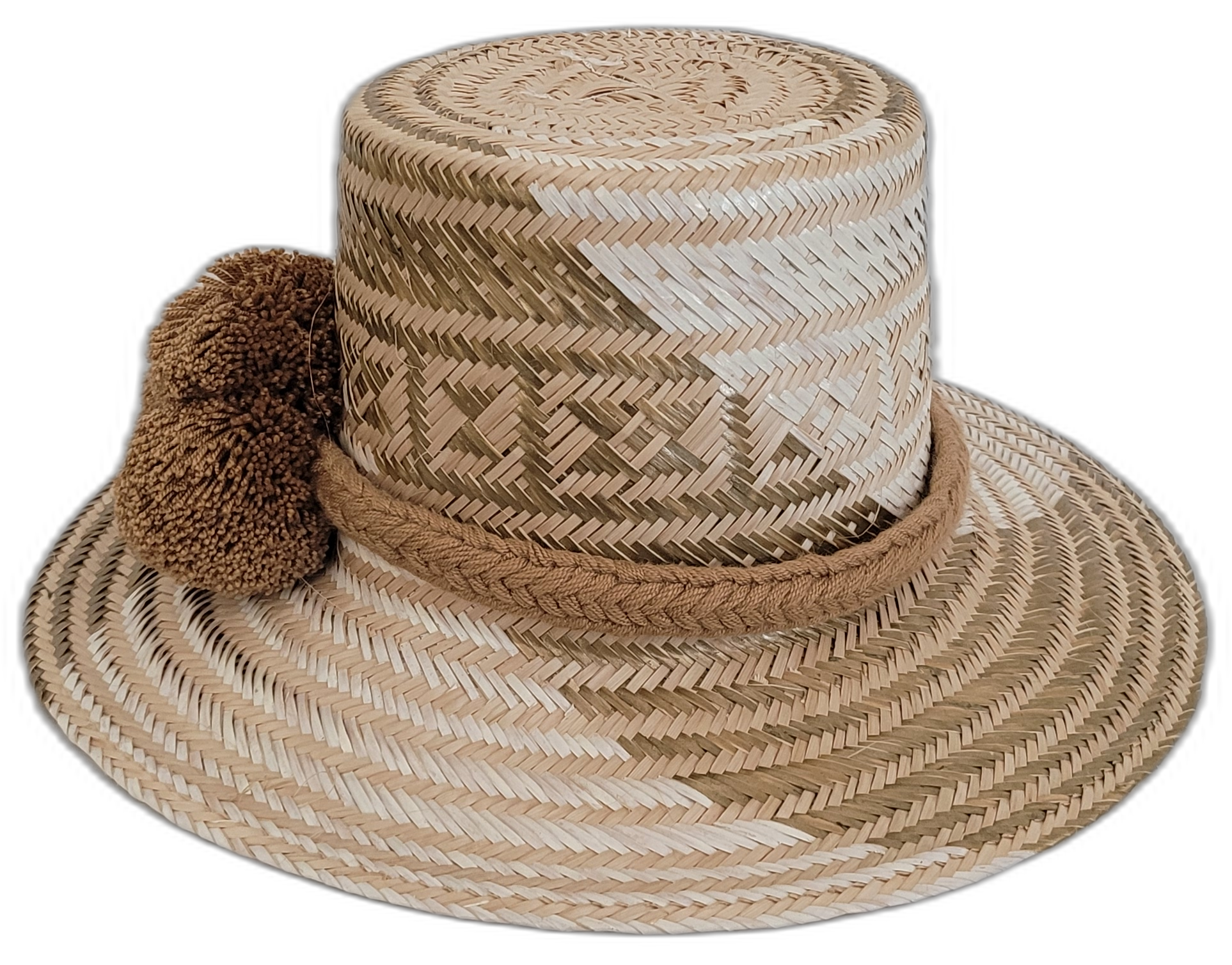 Boho Wayuu hat crafted with earth-tone weave and adorned with brown pompoms.

