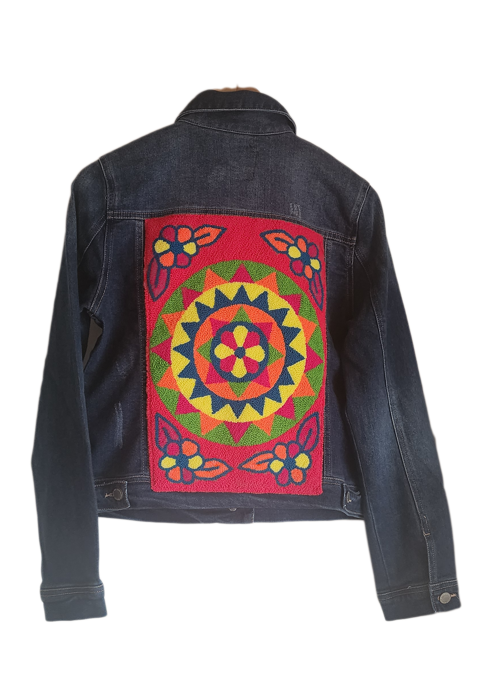 "Artisan-made denim jacket with colorful punch needle embroidery on the back, showcasing unique, vibrant designs."