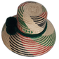 Artisan Wayuu hat with bold red and green accents and forest green pompoms