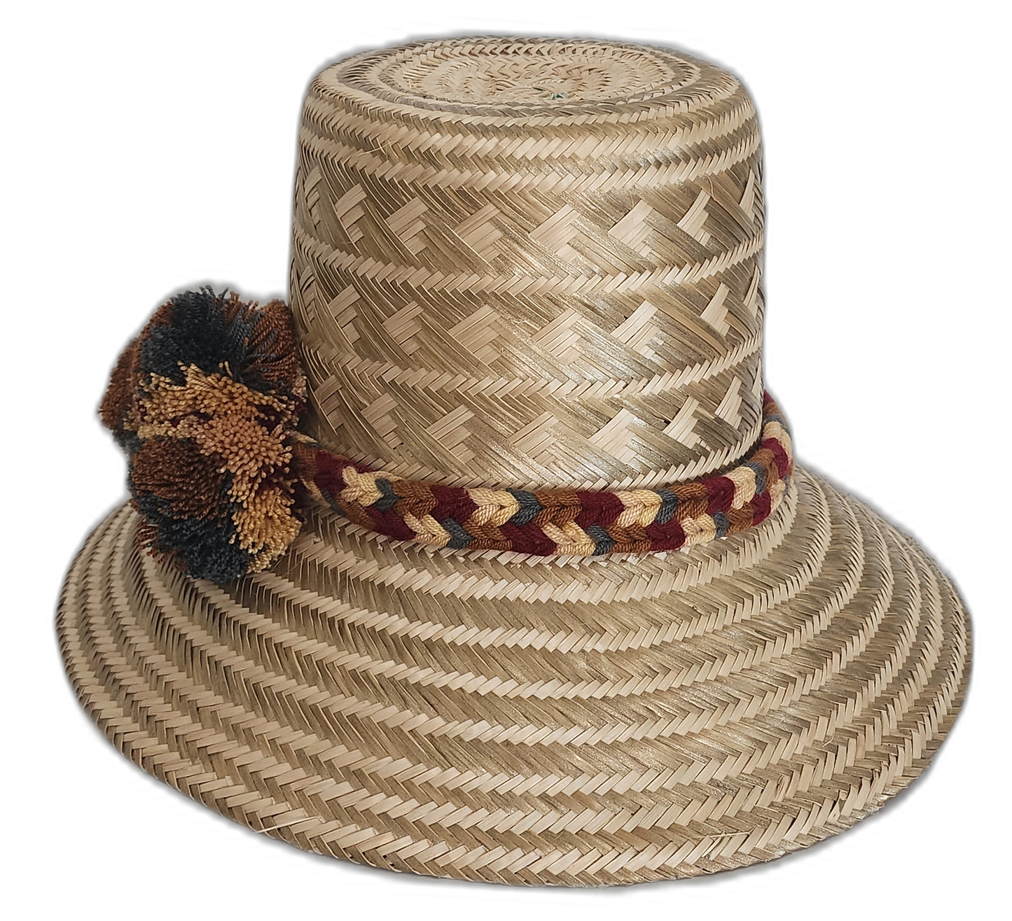 Natural color Wayuu hat with tribal designs and gold-brown pompoms