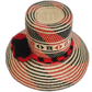 Unique bohemian straw hat featuring artisan details and a bold design

