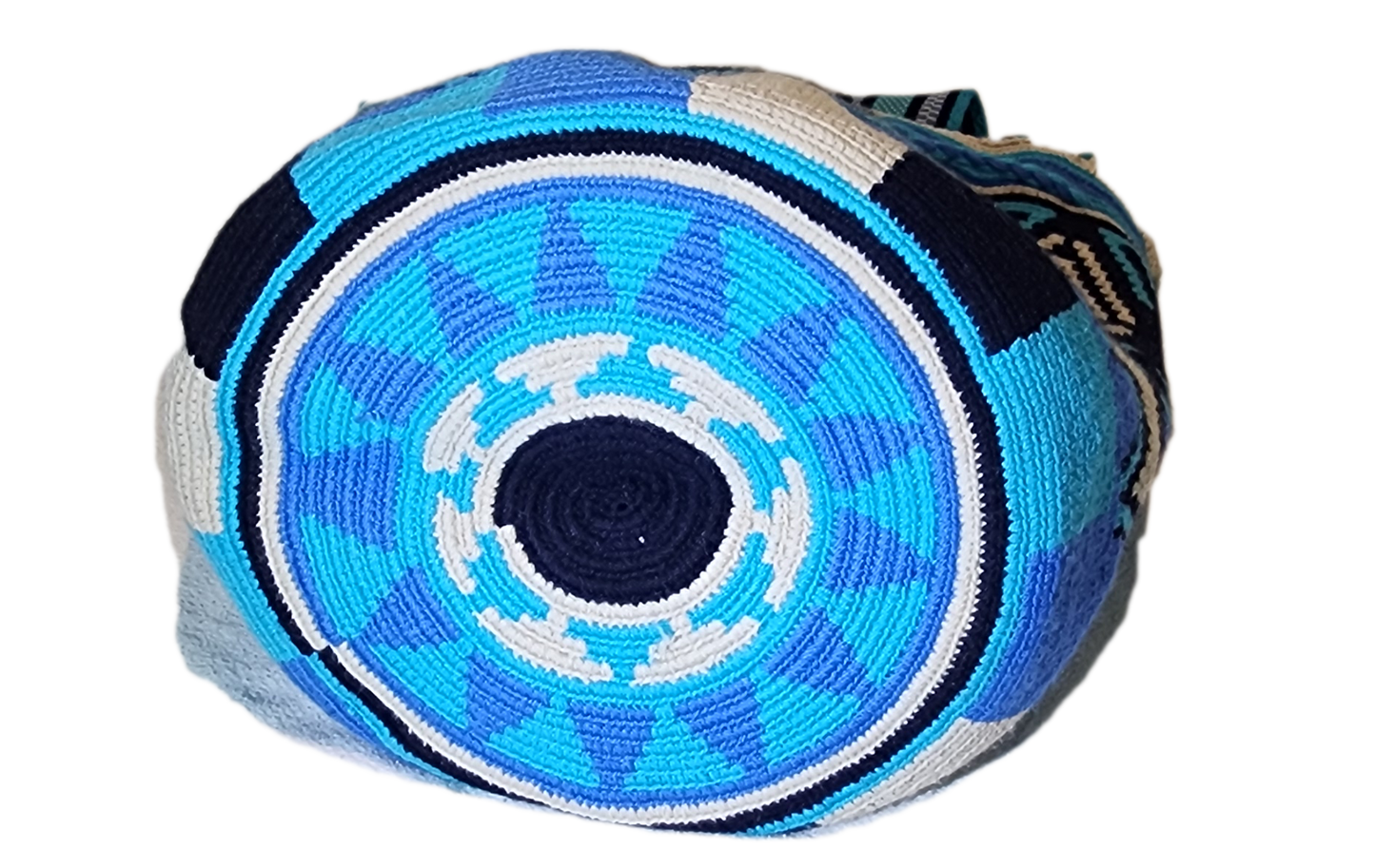 Artisan Wayuu crochet bag with blue diamond motifs and soft woven strap.