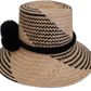 Artisan Wayuu hat, black woven patterns on natural straw, black pompom accent.

