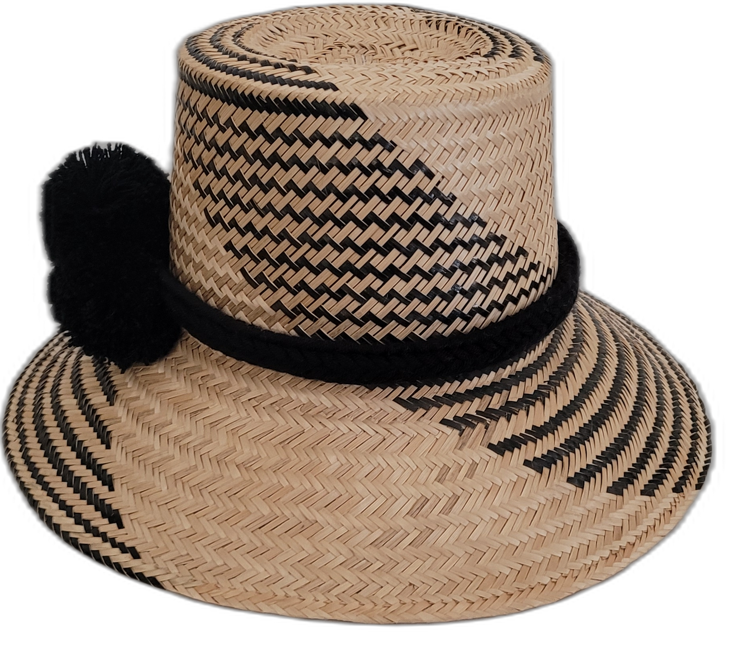 Artisan Wayuu hat, black woven patterns on natural straw, black pompom accent.

