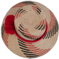 Unique black and red Wayuu straw hat, handmade with red decorative pompoms.

