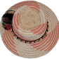 Artisan Wayuu hat in natural palm with woven earth-tone pompoms