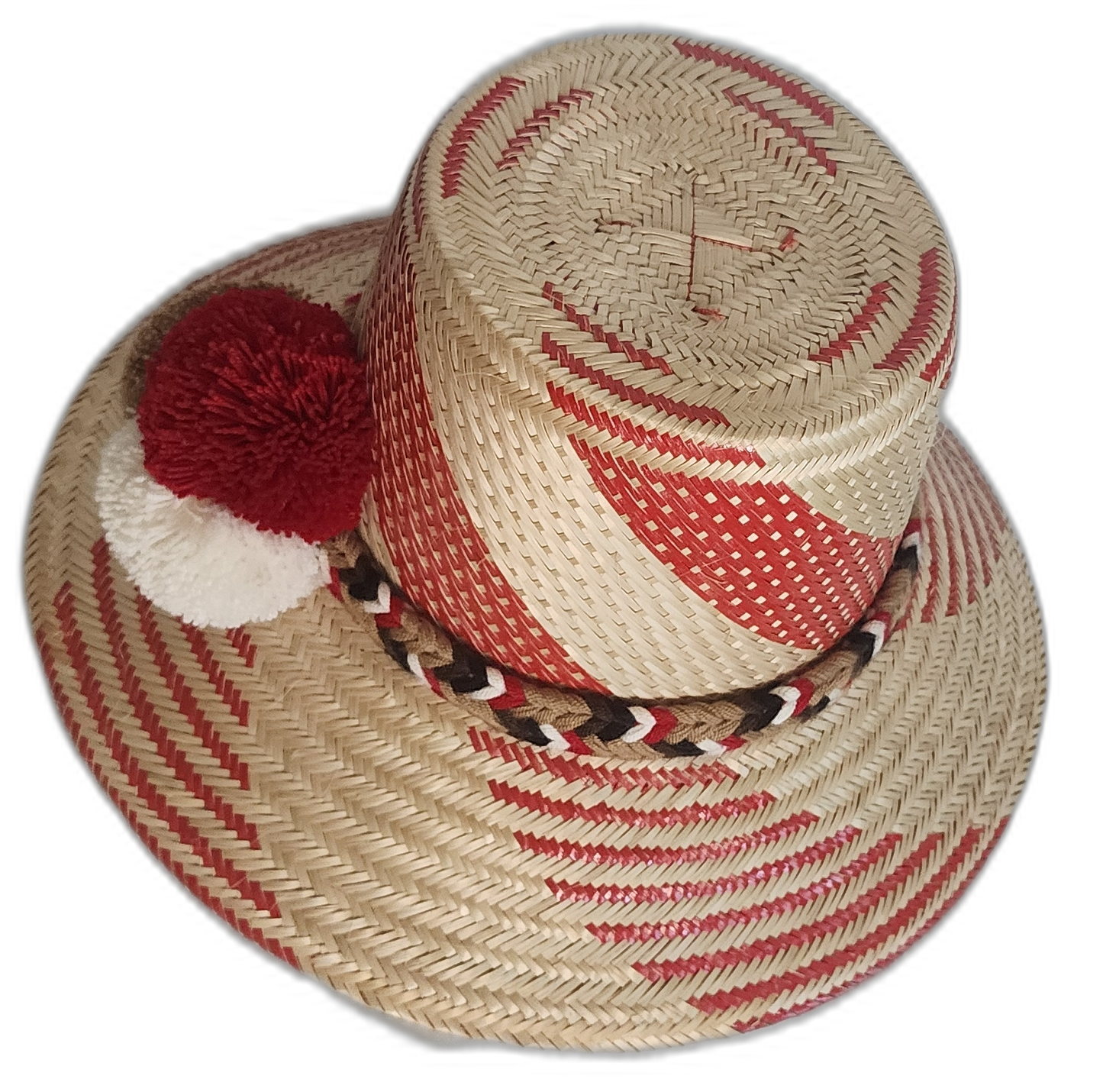 Artisan straw hat with vibrant red designs, handwoven by Wayuu women and finished with traditional pompoms.