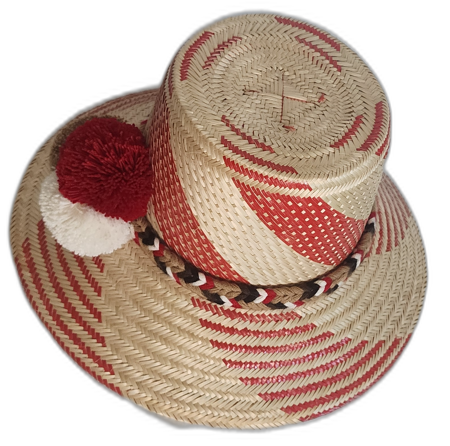 Artisan straw hat with vibrant red designs, handwoven by Wayuu women and finished with traditional pompoms.