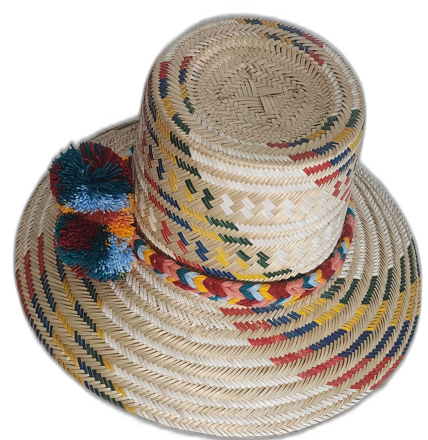Iraca palm Wayuu hat with rich multicolor weave and handmade pompom accents symbolizing cultural meaning.