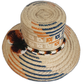 Bohemian summer straw hat with rustic tones and handcrafted pompoms