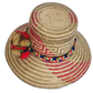 Natural straw Wayuu hat with colorful braided band and pompom accents
