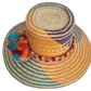 Vibrant artisan Wayuu hat crafted from Iraca palm with summer colors