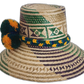 Boho hat with tribal patterns and artisan pompoms in gold and emerald