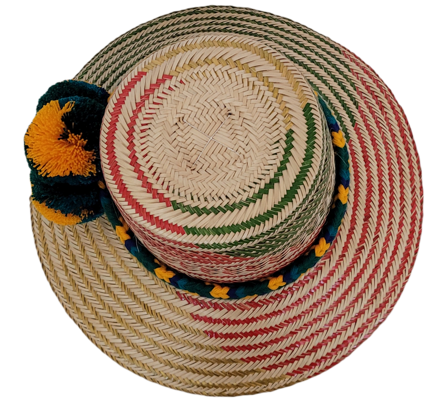 Wayuu woven straw hat with red patterns and vibrant pompoms