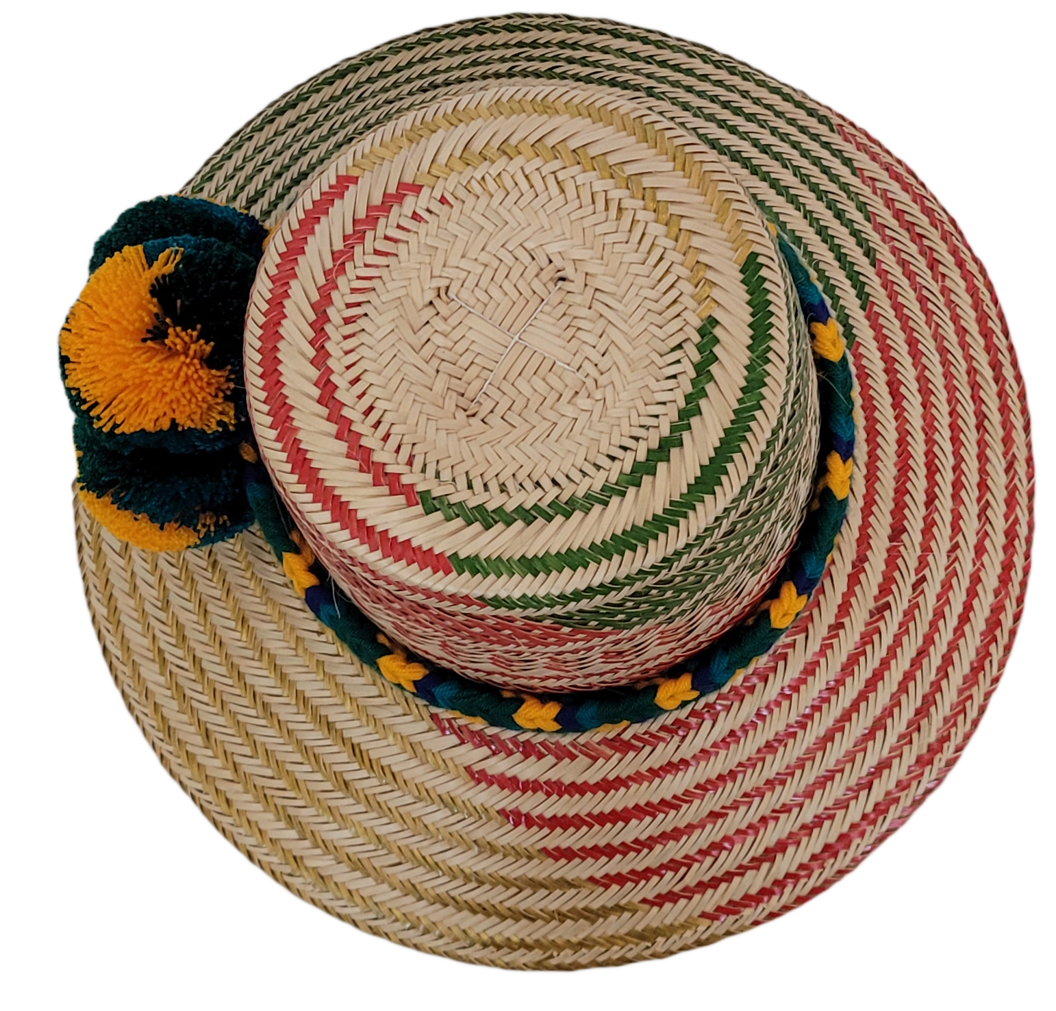 Wayuu woven straw hat with red patterns and vibrant pompoms