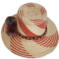 Bohemian chick straw hat with multi-color pompoms and handcrafted details