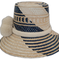 Bohemian chick straw hat from the Wayuu tribe, featuring colorful patterns and pompoms